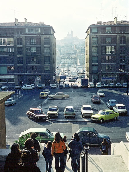 View of Bay between Buildings with Church on Hill in Background